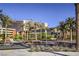 Landscaped street view showcases the Red Rock Casino framed by palm trees and desert foliage at 11576 Ashy Storm Ave, Las Vegas, NV 89138