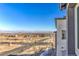 Expansive street view with new homes, mountains in the distance and a clear blue sky on a sunny day at 11576 Ashy Storm Ave, Las Vegas, NV 89138