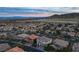 Community aerial view with scenic landscape, mountain range, and open blue skies at 12118 La Carta Ct, Las Vegas, NV 89138