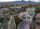 Wide angle aerial view of the home in a mature neighborhood and featuring solar panels at 12118 La Carta Ct, Las Vegas, NV 89138