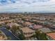 Wide aerial view showcasing community and distant skyline at 12118 La Carta Ct, Las Vegas, NV 89138