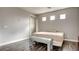 Neutral bedroom with hardwood floors, neutral paint, bench seat and window at 12118 La Carta Ct, Las Vegas, NV 89138