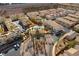 Aerial view of a community featuring a pool and palm tree lined roundabout at 1525 Spiced Wine Ave # 12103, Henderson, NV 89074