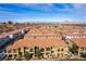 An aerial view of a neighborhood of townhomes under a clear blue sky at 1525 Spiced Wine Ave # 12103, Henderson, NV 89074