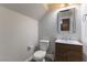 Cozy bathroom featuring a modern vanity with a decorative mirror and a toilet at 1525 Spiced Wine Ave # 12103, Henderson, NV 89074