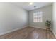 Bright bedroom with luxury vinyl plank flooring, a ceiling fan, and a window at 1525 Spiced Wine Ave # 12103, Henderson, NV 89074