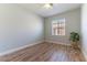 Bright bedroom with luxury vinyl plank flooring, a ceiling fan, and a window at 1525 Spiced Wine Ave # 12103, Henderson, NV 89074