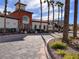 Elegant community entrance framed by tall palm trees on a sunny day at 1525 Spiced Wine Ave # 12103, Henderson, NV 89074