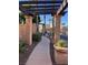 Charming community entrance featuring a pergola walkway, manicured landscaping and gated access at 1525 Spiced Wine Ave # 12103, Henderson, NV 89074