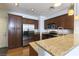 Modern kitchen featuring stainless steel appliances, granite countertops and breakfast bar seating at 1525 Spiced Wine Ave # 12103, Henderson, NV 89074