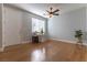 Bright living room with gleaming hardwood floors and a contemporary ceiling fan at 1525 Spiced Wine Ave # 12103, Henderson, NV 89074