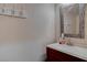 Close-up of a clean bathroom sink with modern fixtures and a decorative mirror at 1534 Waterford Falls Ave, Las Vegas, NV 89123