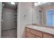 Bathroom featuring single sink vanity and a walk-in closet at 1534 Waterford Falls Ave, Las Vegas, NV 89123