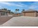 A huge concrete driveway leads to a detached garage and sunroom at 1534 Waterford Falls Ave, Las Vegas, NV 89123