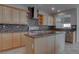 Kitchen island featuring stainless steel appliances and granite countertops at 1534 Waterford Falls Ave, Las Vegas, NV 89123