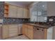 Kitchen with stainless steel appliances, granite countertops, and tiled backsplash at 1534 Waterford Falls Ave, Las Vegas, NV 89123