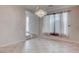 Open living room with tile floors, natural light, and chandelier at 1534 Waterford Falls Ave, Las Vegas, NV 89123