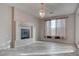 Living room featuring tile floors, fireplace, and natural light at 1534 Waterford Falls Ave, Las Vegas, NV 89123