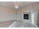 Bright living room featuring tile floors and a gas fireplace at 1534 Waterford Falls Ave, Las Vegas, NV 89123