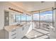 Bathroom featuring double sink vanity, modern lighting, and expansive windows with panoramic city views at 200 W Sahara Ave # 2108, Las Vegas, NV 89102