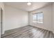 Bright bedroom featuring hardwood floors and a large window with a beautiful city view at 200 W Sahara Ave # 2108, Las Vegas, NV 89102
