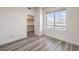 Bright bedroom features a window and an open walk-in closet at 200 W Sahara Ave # 2108, Las Vegas, NV 89102