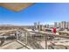 Expansive city view from a balcony, showcasing multiple buildings and the distant mountain range at 200 W Sahara Ave # 2108, Las Vegas, NV 89102