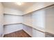 Spacious walk-in closet featuring custom wood shelving and ample storage space for an organized wardrobe at 200 W Sahara Ave # 2108, Las Vegas, NV 89102