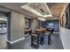 Stylish dining area with unique wooden table and industrial-chic stools at 200 W Sahara Ave # 2108, Las Vegas, NV 89102