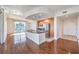 Modern kitchen with stainless steel appliances and granite-topped island adjacent to a spacious living and dining area at 200 W Sahara Ave # 2108, Las Vegas, NV 89102