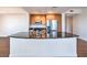 Close up of the kitchen island with granite countertops, stainless steel sink, and white cabinetry at 200 W Sahara Ave # 2108, Las Vegas, NV 89102