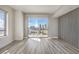 Sun-filled living room with city views, sleek floors, and accent wall at 200 W Sahara Ave # 2108, Las Vegas, NV 89102