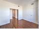 Open floor plan living room boasts wood floors and bright interior doors at 200 W Sahara Ave # 2108, Las Vegas, NV 89102