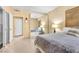 Bedroom featuring a mirror closet, neutral tones and a comfortable bed at 260 E Flamingo Rd # 311, Las Vegas, NV 89169