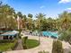 Relaxing poolside cabana and seating surrounded by lush landscaping and palm trees at 260 E Flamingo Rd # 311, Las Vegas, NV 89169