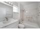 Well-lit bathroom features a combined tub and shower with sleek fixtures, vanity, and stone countertops at 2612 Springridge Dr, Las Vegas, NV 89134