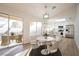 Bright dining area with modern table, chairs, and view to the backyard at 2612 Springridge Dr, Las Vegas, NV 89134