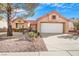 Charming single-story home with a red tile roof and low-maintenance desert landscaping at 2612 Springridge Dr, Las Vegas, NV 89134