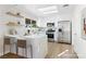 Bright kitchen with white cabinets, stainless steel appliances and quartz countertops at 2612 Springridge Dr, Las Vegas, NV 89134