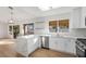 Bright, updated kitchen featuring white cabinets, quartz countertops, and stainless steel appliances at 2612 Springridge Dr, Las Vegas, NV 89134