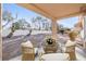 Inviting patio with wicker furniture, providing a cozy outdoor seating area to enjoy the backyard view at 2612 Springridge Dr, Las Vegas, NV 89134