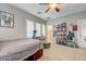 Bedroom featuring neutral walls, window shutters, carpeted floor, and an array of musical instruments and memorabilia at 2796 Rosenhearty Dr, Henderson, NV 89044