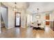 Elegant dining area featuring hardwood floors, stylish lighting, and a well-appointed dining set at 2796 Rosenhearty Dr, Henderson, NV 89044