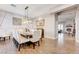 Formal dining area with seating for eight and a view into the living room with fireplace at 2796 Rosenhearty Dr, Henderson, NV 89044