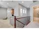 Upper hallway with carpet, a built in desk, and access to an en suite bathroom at 2796 Rosenhearty Dr, Henderson, NV 89044