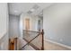 Second story hallway with carpet, stair access and access to an en suite bathroom at 2796 Rosenhearty Dr, Henderson, NV 89044