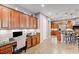 Bright kitchen with granite counters, wood cabinets and stainless steel appliances at 2796 Rosenhearty Dr, Henderson, NV 89044