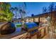 Outdoor kitchen with a built-in grill and a view of the pool at 2796 Rosenhearty Dr, Henderson, NV 89044