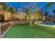 Pool with lush landscaping creating a serene and private oasis in the backyard at 2796 Rosenhearty Dr, Henderson, NV 89044