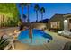 Pool with lush landscaping and ample seating, perfect for outdoor gatherings at 2796 Rosenhearty Dr, Henderson, NV 89044